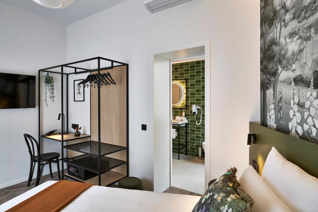 Postel nebo postele na pokoji v ubytování Urban Yard Hotel