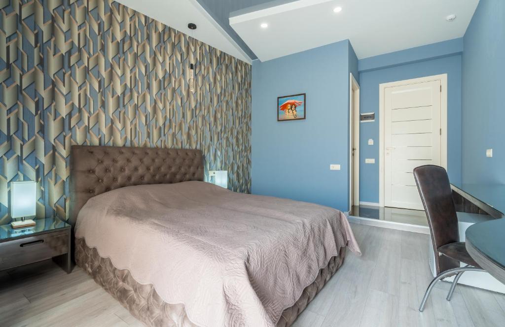 Postel nebo postele na pokoji v ubytování Constant Tbilisi