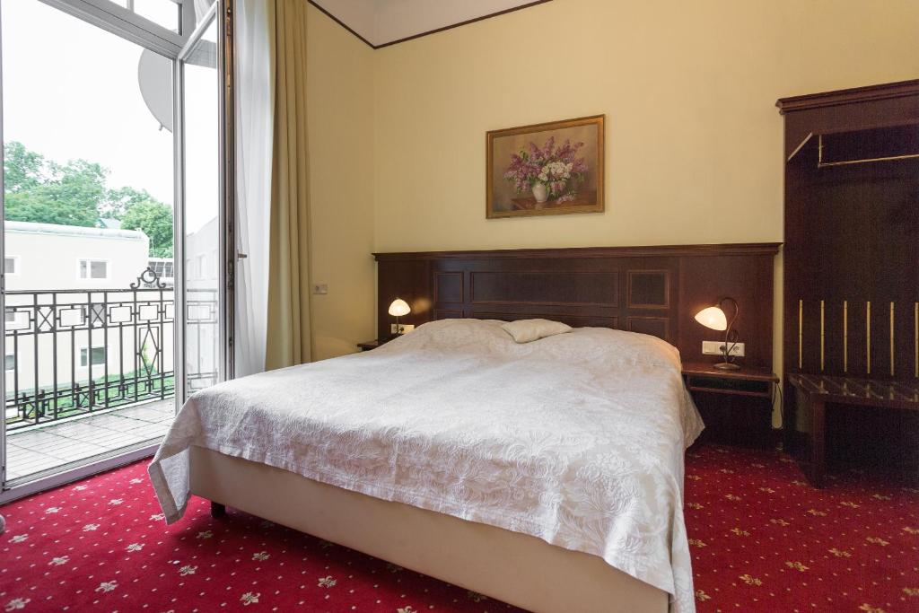 Voodi või voodid majutusasutuse Hotel Viktoria Schönbrunn toas