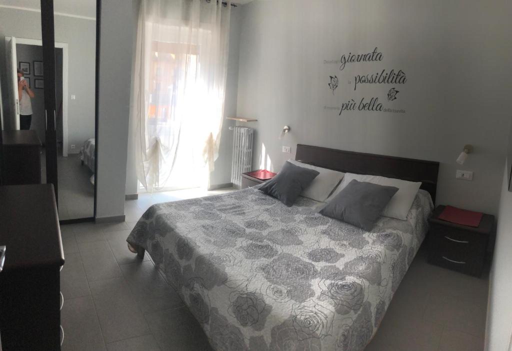 a bedroom with a large bed in a room at La casa di Monicamos - CIR Aosta 0034 - Bilocale in Aosta