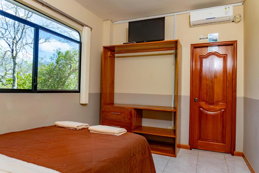 Postel nebo postele na pokoji v ubytování Cucuve Eco Hostal