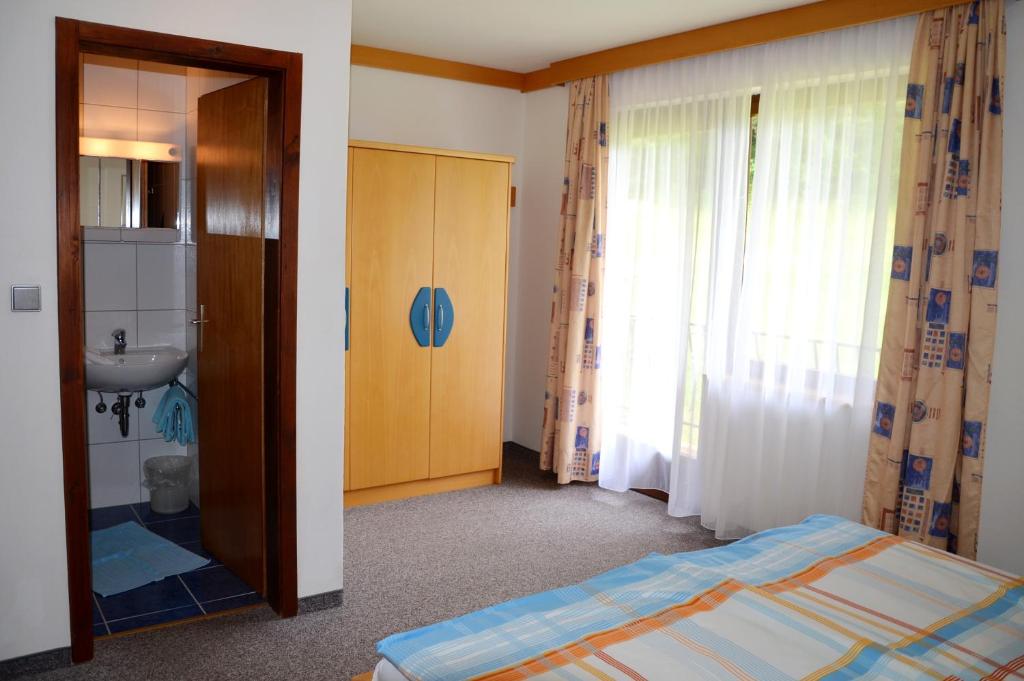 Postel nebo postele na pokoji v ubytování Pension Hribernig