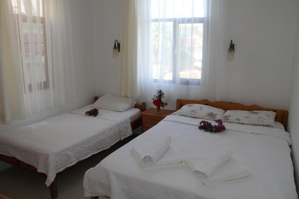 A bed or beds in a room at Jet Pension