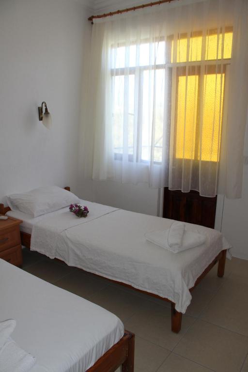 A bed or beds in a room at Jet Pension