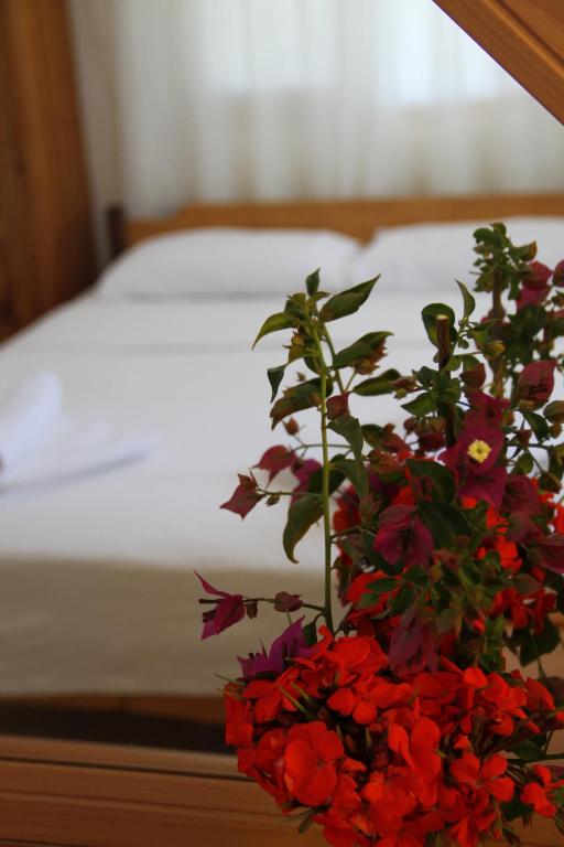 A bed or beds in a room at Jet Pension