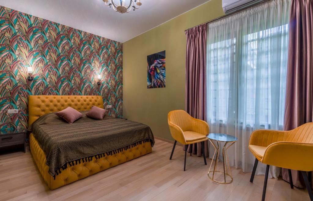 Postel nebo postele na pokoji v ubytování Constant Tbilisi