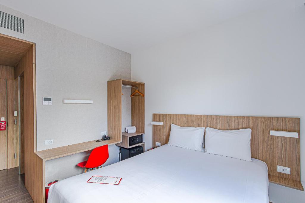 Postel nebo postele na pokoji v ubytování Hotel Moov Curitiba