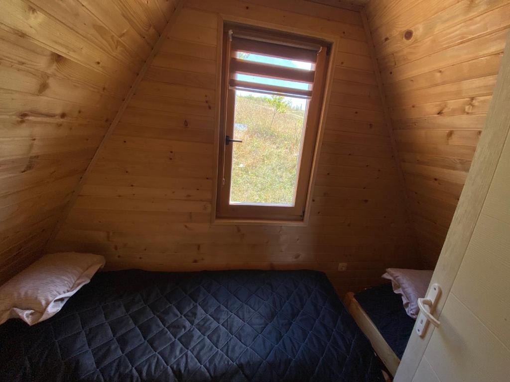 Postel nebo postele na pokoji v ubytování UVAC-Etno selo Kaćo