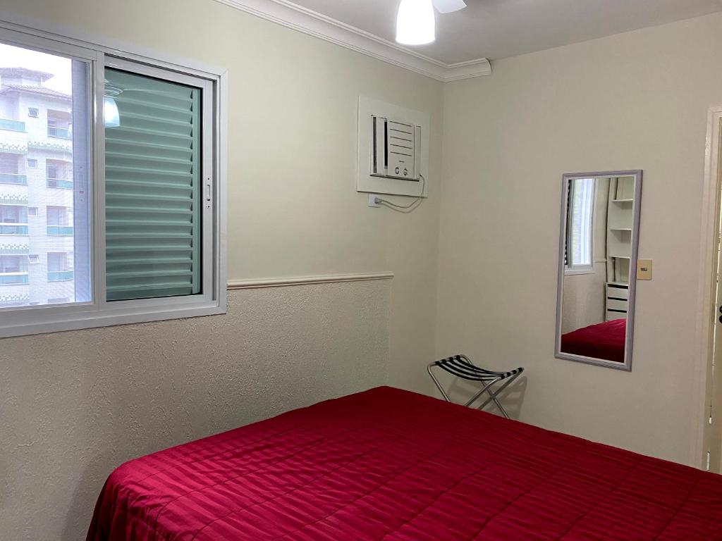 Ein Bett oder Betten in einem Zimmer der Unterkunft Apartamento Praia Grande Ubatuba