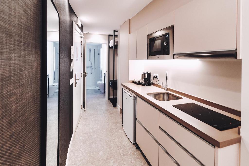 Kuchyň nebo kuchyňský kout v ubytování GBH Hotel-Apartamentos Posidonia
