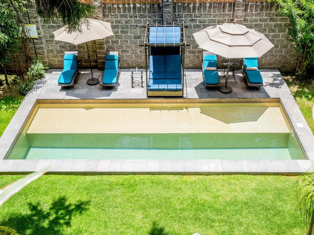 Výhled na bazén z ubytování Hotel Boutique Camino Del Bosque by Rotamundos nebo okolí