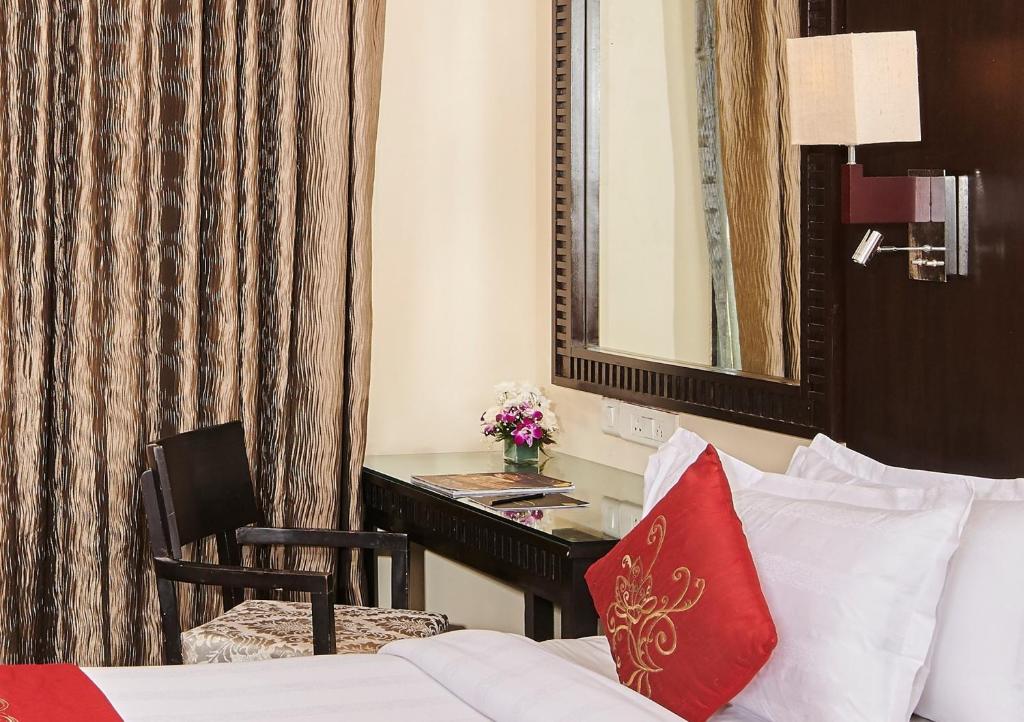Postel nebo postele na pokoji v ubytování Goldfinch Hotel Mumbai