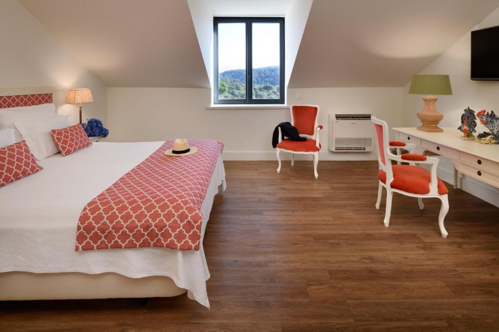 Кровать или кровати в номере Hotel Casa Palmela - Small Luxury Hotels of The World, Hotel & Villas