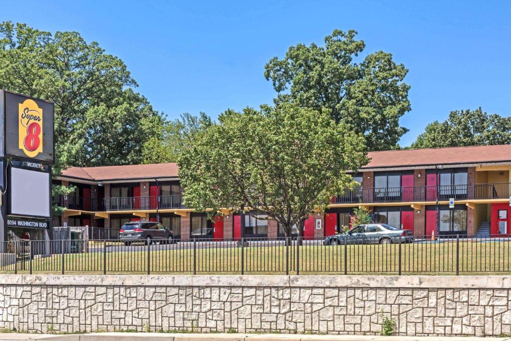 a building with cars parked in front of it at Super 8 by Wyndham Jessup/Baltimore Area in Jessup