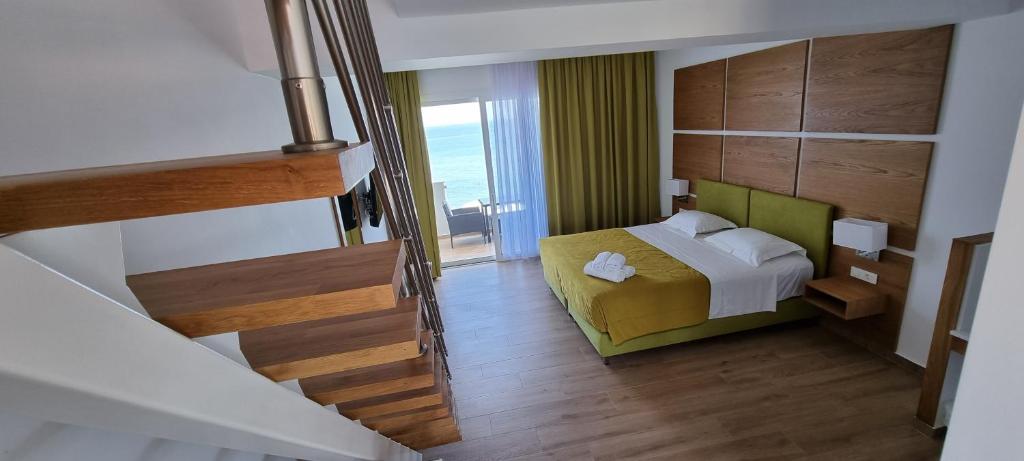Postel nebo postele na pokoji v ubytování Stefania Apartments
