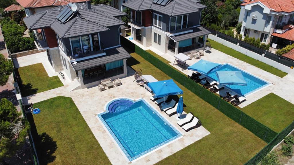 an aerial view of a house with a swimming pool at KEYSAN VILLAS in Ortaca