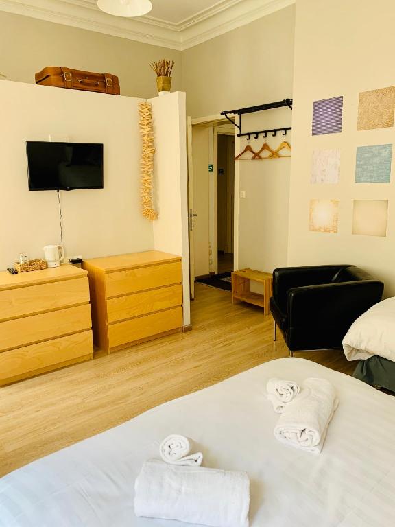 Postel nebo postele na pokoji v ubytování Hotel Du Parlement
