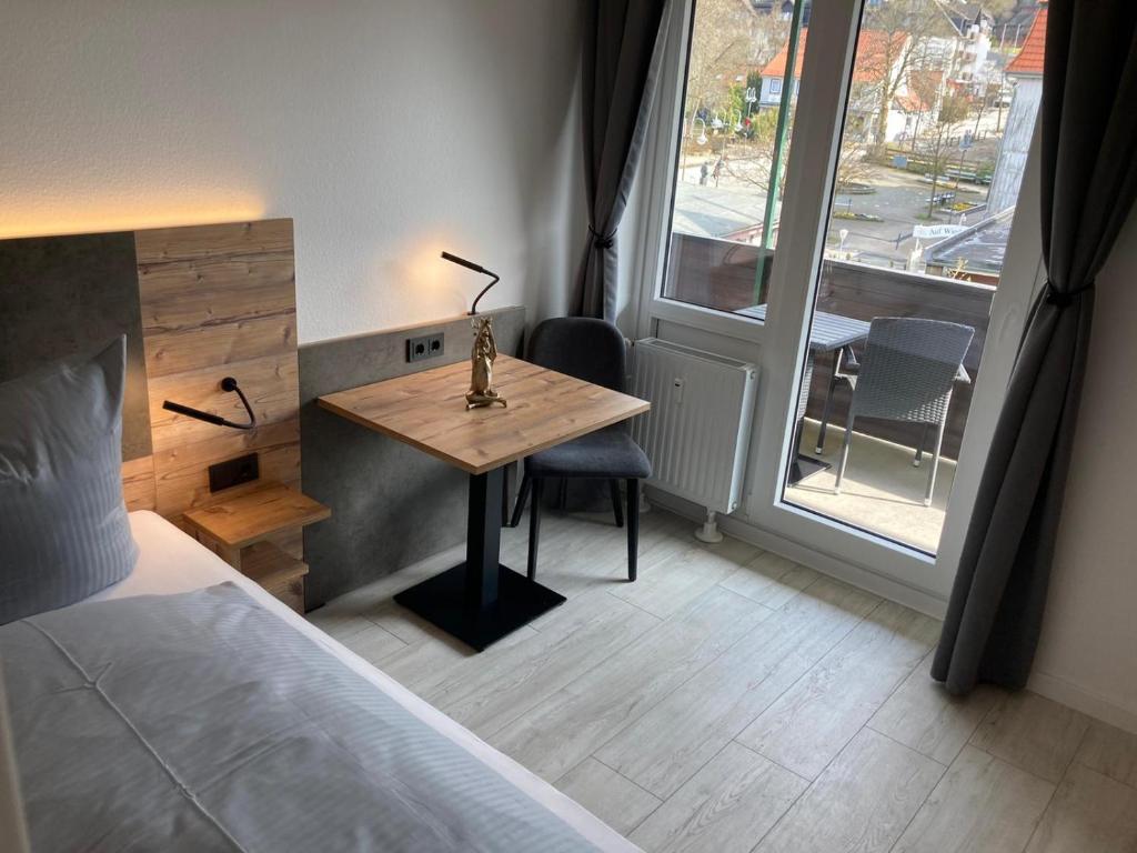 Postel nebo postele na pokoji v ubytování Hostel Harzer Hof