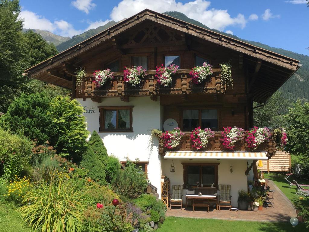 a house with flower boxes on the front of it at Haus Marco in Neustift im Stubaital