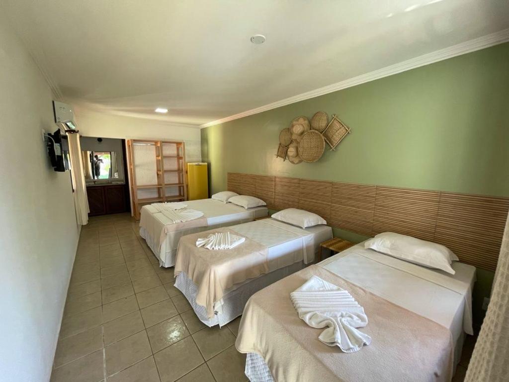 Postel nebo postele na pokoji v ubytování MUTA PRAIA HOTEL
