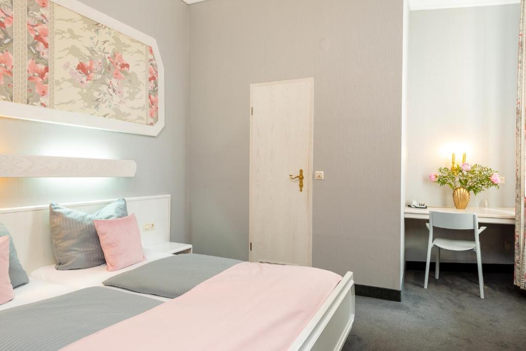 Postel nebo postele na pokoji v ubytování W22 Hotel am Kurfürstendamm