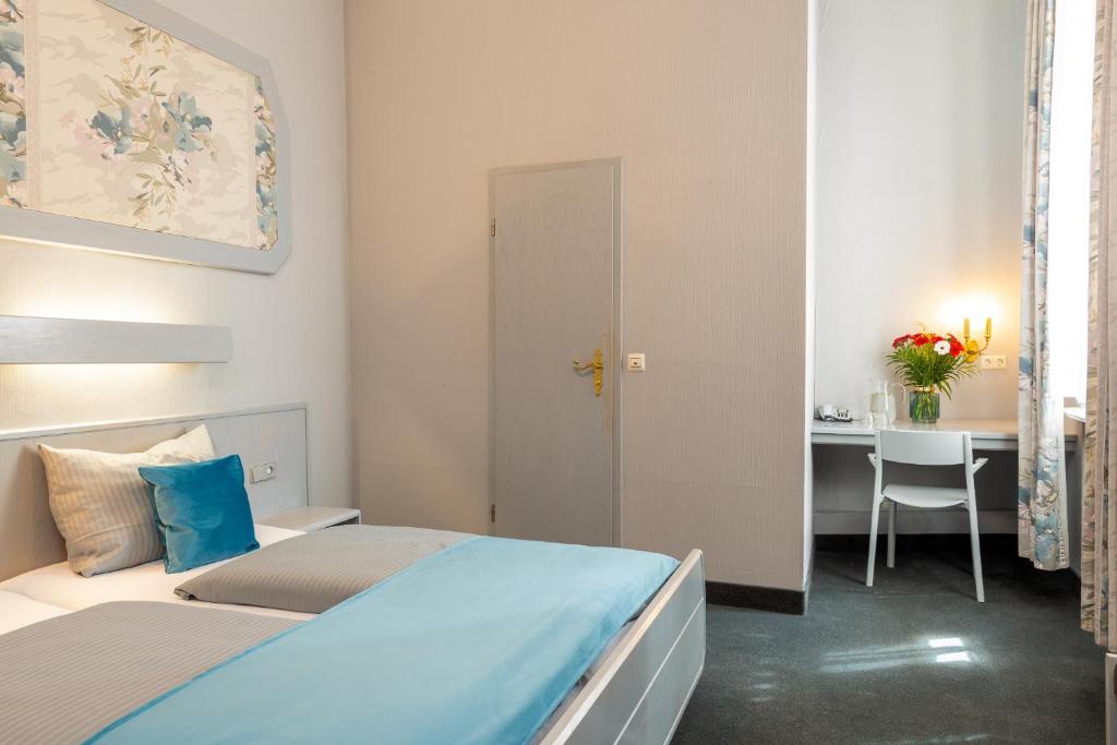 Postel nebo postele na pokoji v ubytování W22 Hotel am Kurfürstendamm