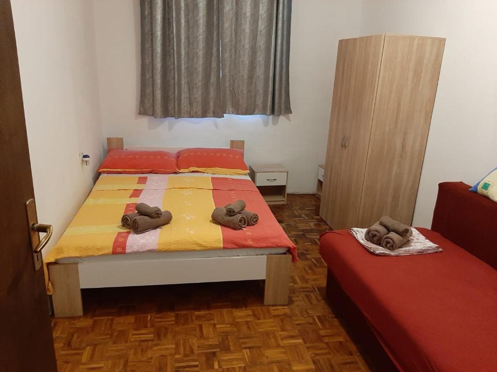 Ліжко або ліжка в номері Apartment Tomo