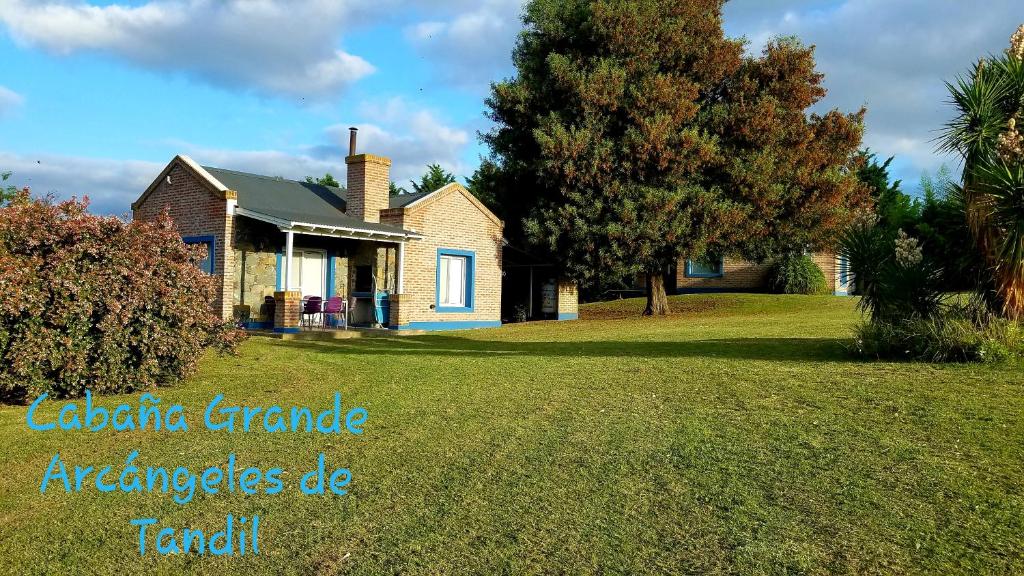 a house on a lawn with the words electric garage appliances de radar at Cabañas Arcángeles de Tandil in Tandil