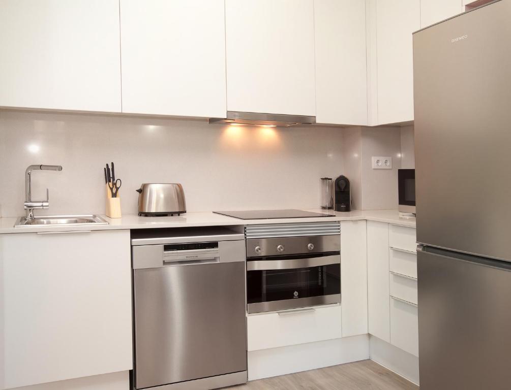 Kuchyň nebo kuchyňský kout v ubytování APBCN Eixample Center