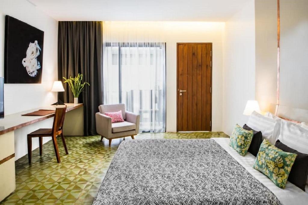 Postel nebo postele na pokoji v ubytování Atelier Hotel