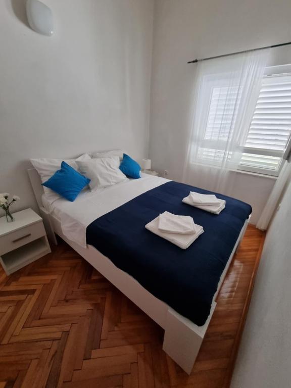 Posteľ alebo postele v izbe v ubytovaní Apartman Gabrijel