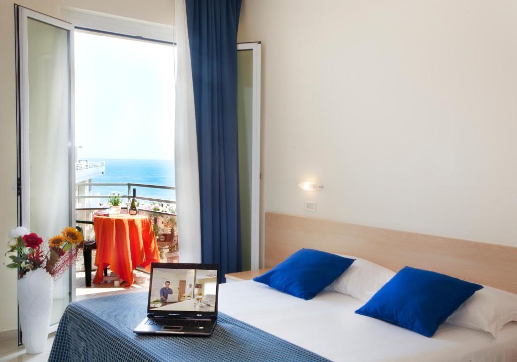 Postel nebo postele na pokoji v ubytování Hotel Fantasy