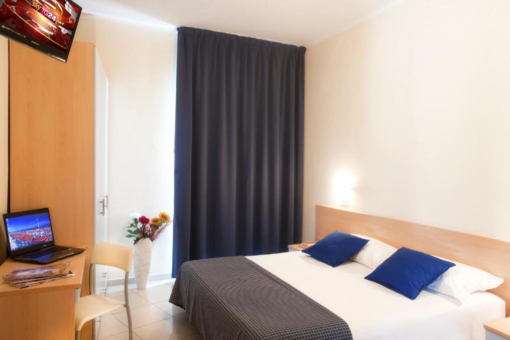 Postel nebo postele na pokoji v ubytování Hotel Fantasy
