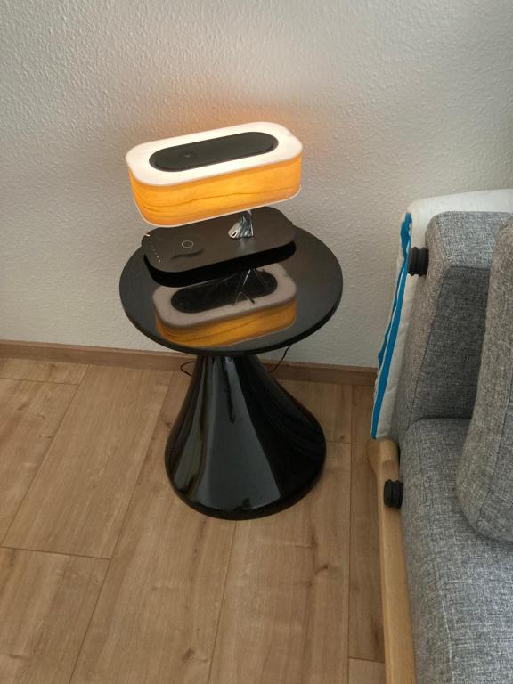 a side table with a table with a foodachi at Premium City Apartment Dresden in Dresden