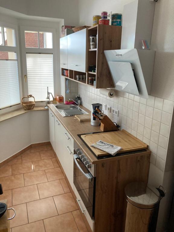 a small kitchen with a sink and a stove at Premium City Apartment Dresden in Dresden