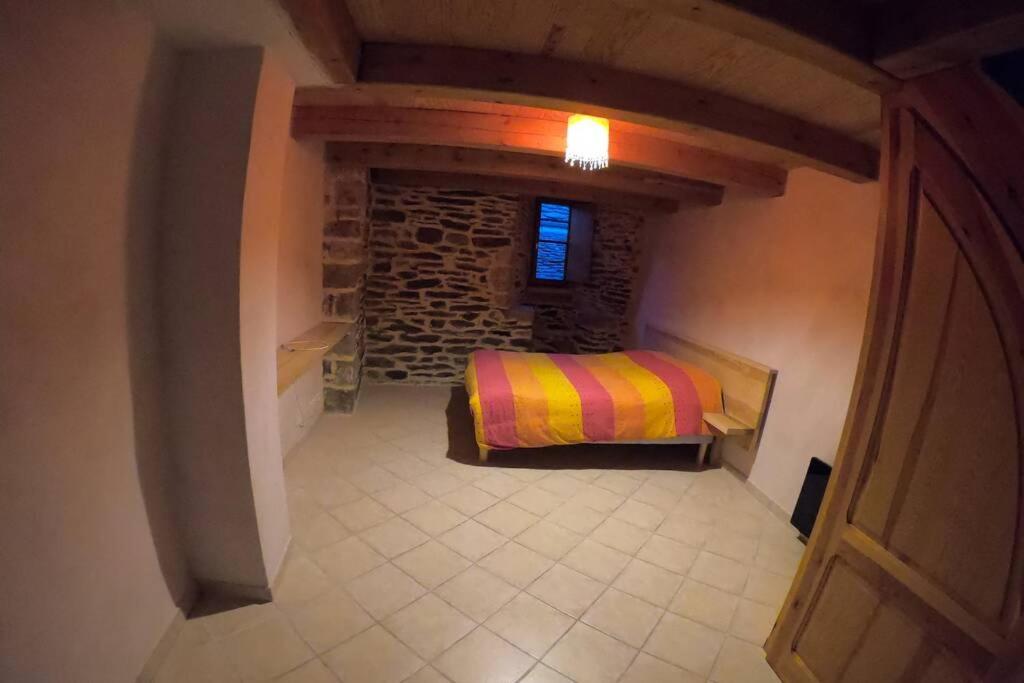 Postel nebo postele na pokoji v ubytování Gîte Ispagnac