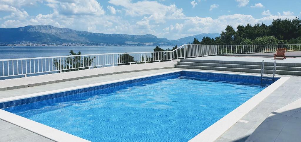 a swimming pool with a view of the water at Apartment Kate Slatine in Slatine
