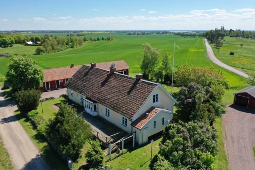 an aerial view of a large white house at Stubbegården - Unique swedish style in Vadstena