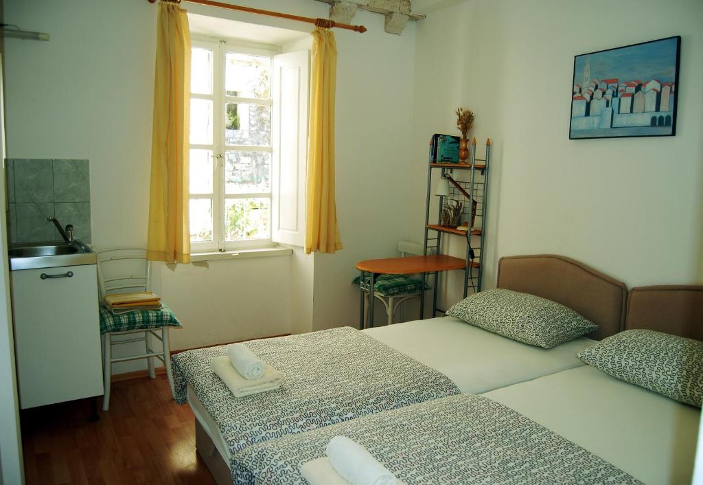 Ein Bett oder Betten in einem Zimmer der Unterkunft Marco Polo Apartments