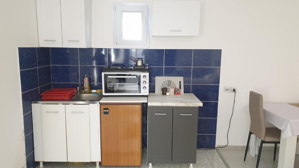 Kuchyň nebo kuchyňský kout v ubytování Apartman Sava
