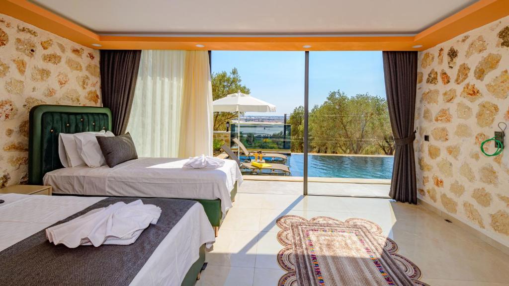 The swimming pool at or close to Zen - 2 Bedroom with jacuzzi in Kalkan Çayköy