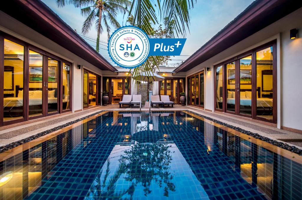 a pool at the shka pust resort and spa at Pai Tan Villas - SHA Extra Plus in Bang Tao Beach