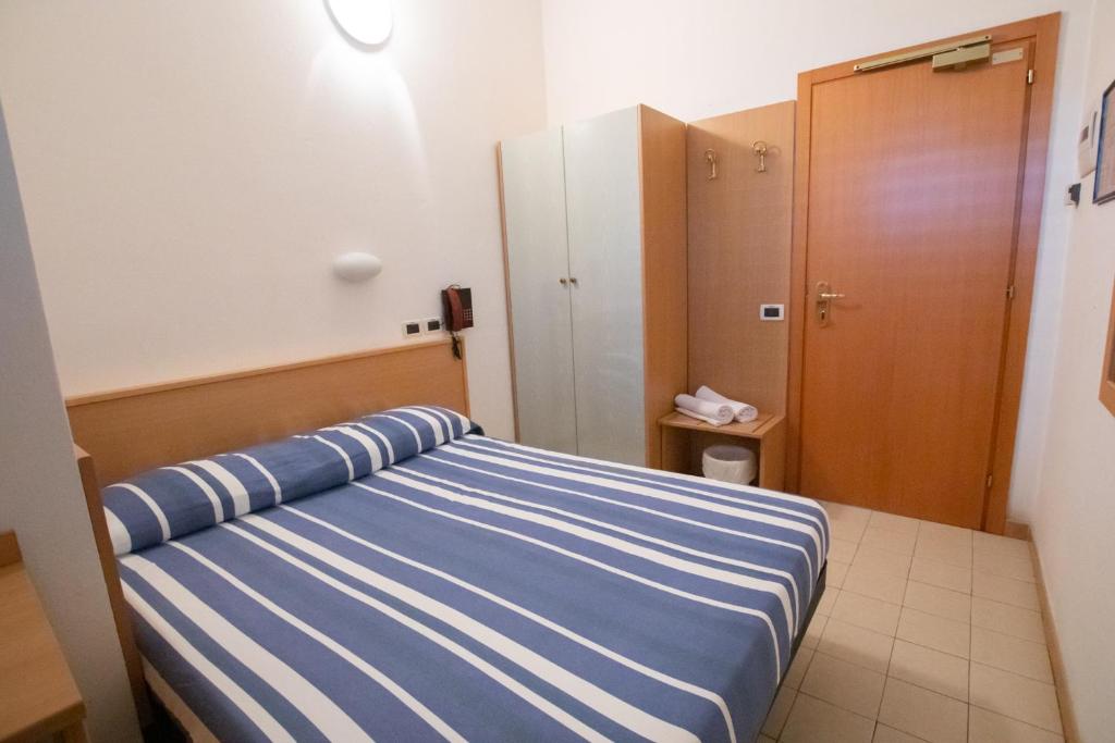 Postel nebo postele na pokoji v ubytování Piccolo Hotel