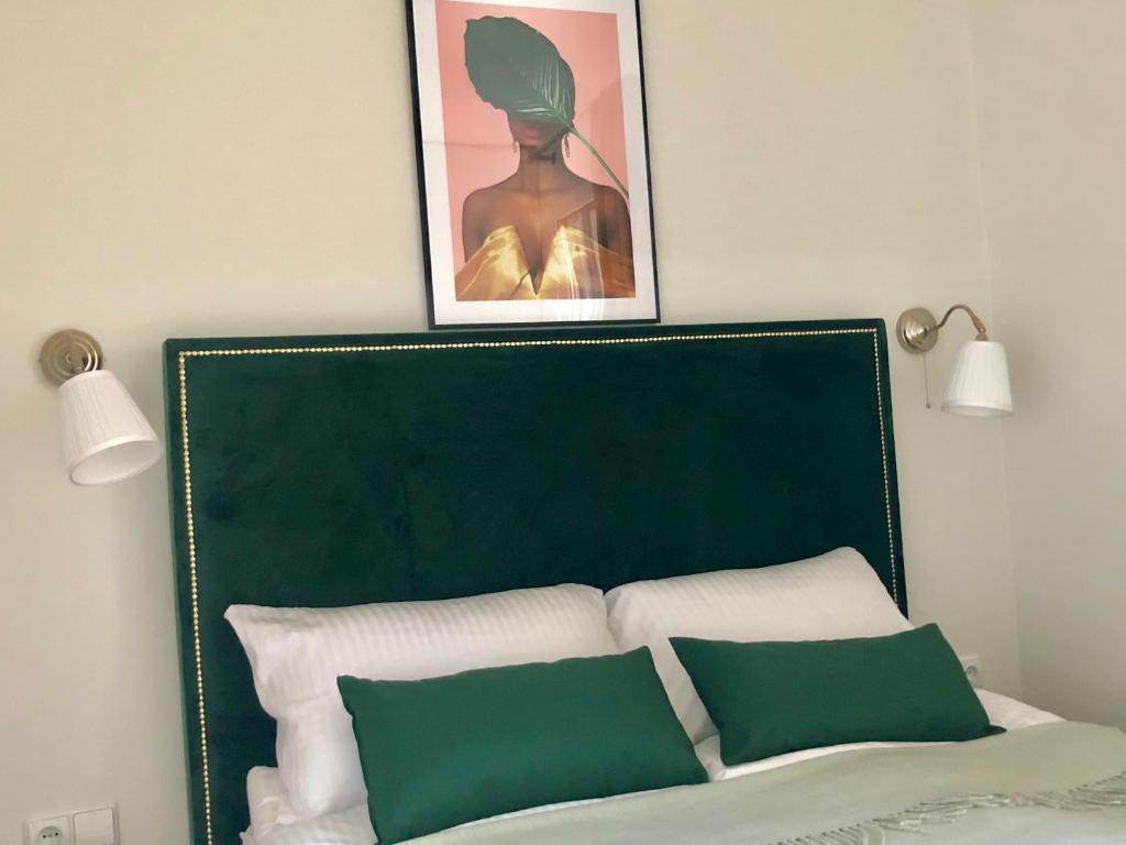 Ένα ή περισσότερα κρεβάτια σε δωμάτιο στο R.J. Apartamentai. Kunigiškės