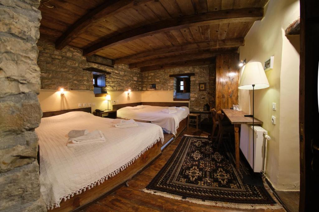 A bed or beds in a room at Arhontiko Aristis