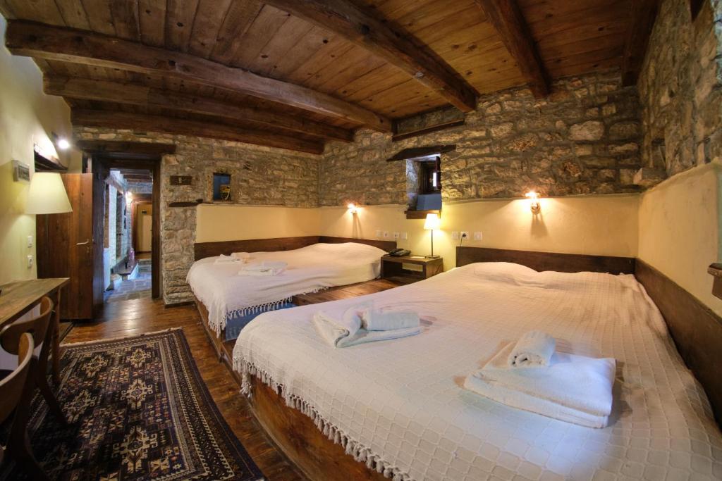 A bed or beds in a room at Arhontiko Aristis