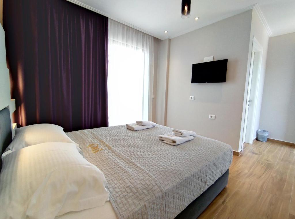 Postel nebo postele na pokoji v ubytování Villa Primo Opus