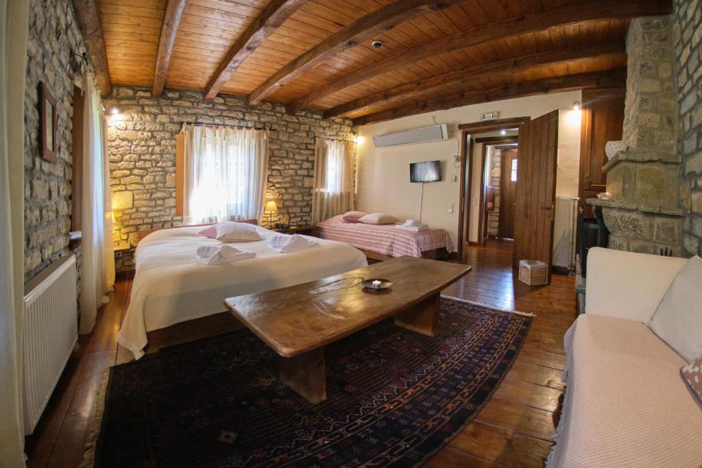 A bed or beds in a room at Arhontiko Aristis