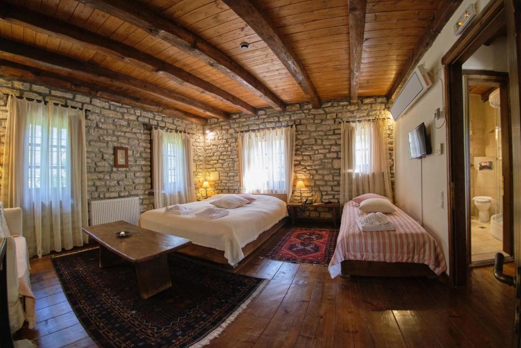 A bed or beds in a room at Arhontiko Aristis