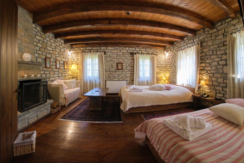 A bed or beds in a room at Arhontiko Aristis